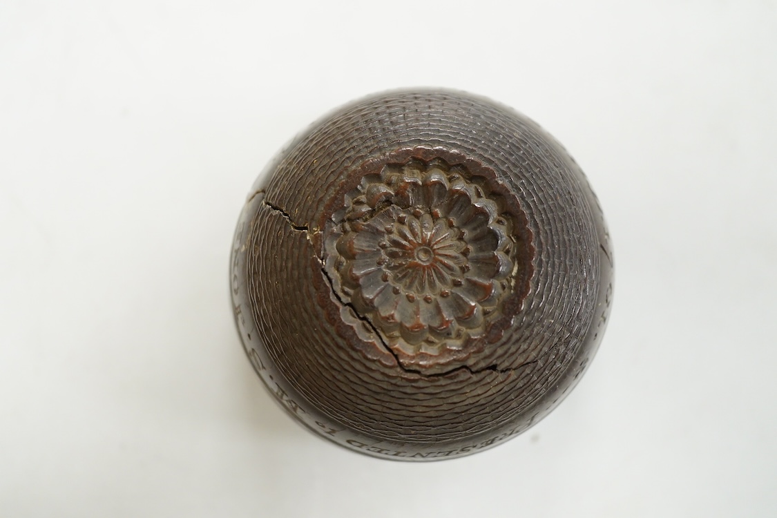 A 19th century or earlier engine-turned lignum vitae tumbler cup, engraved ‘Presented to M. S. Jones by a Friend 1834 AD 1701 +’, 6.5cm high, by repute found on the roof plate of Kenwood house London in 2012, during reno